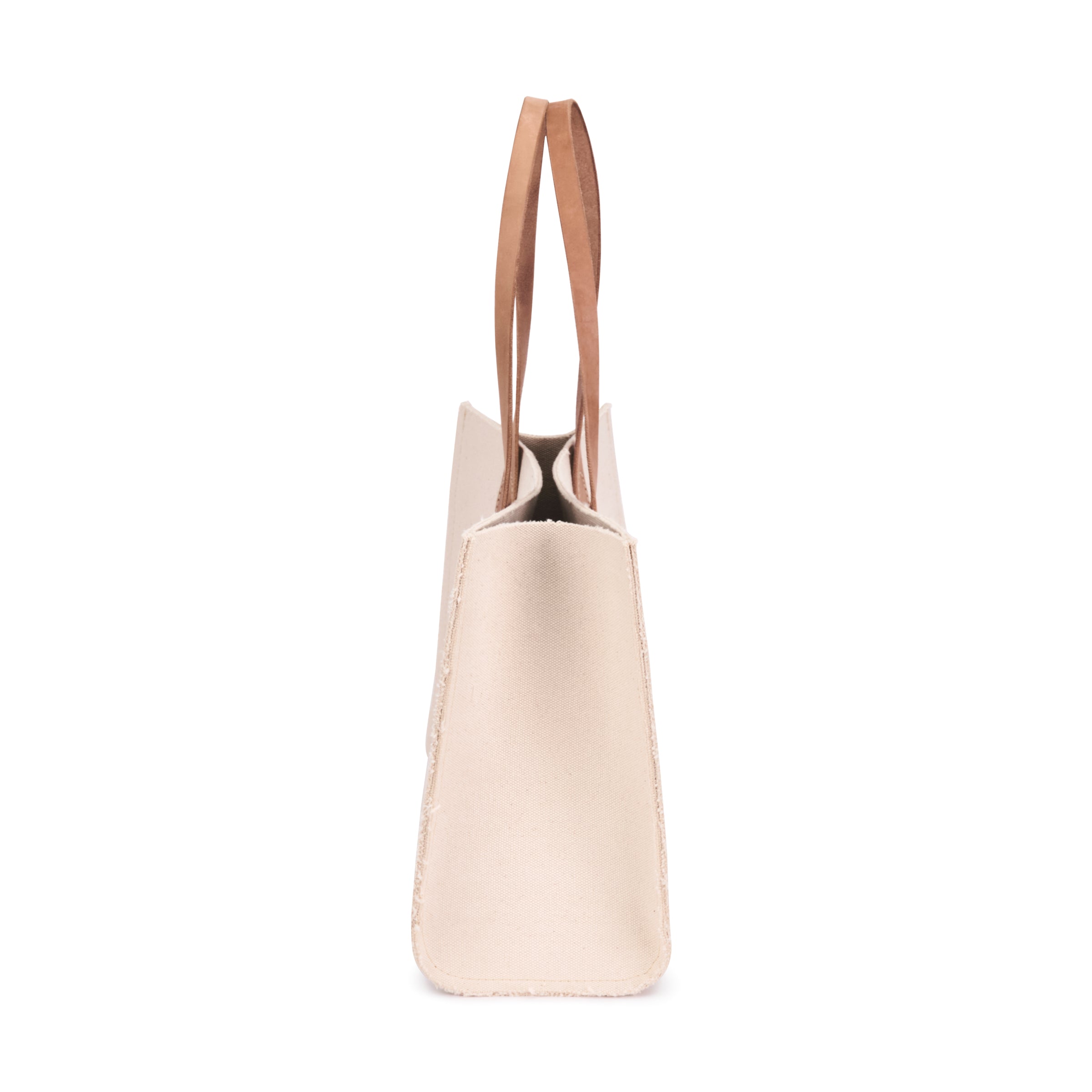A side view of the Ava Canvas Tote in Beige by Ezra Arthur