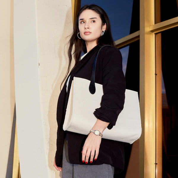 An editorial image of the Ava Canvas Tote in Black by Ezra Arthur