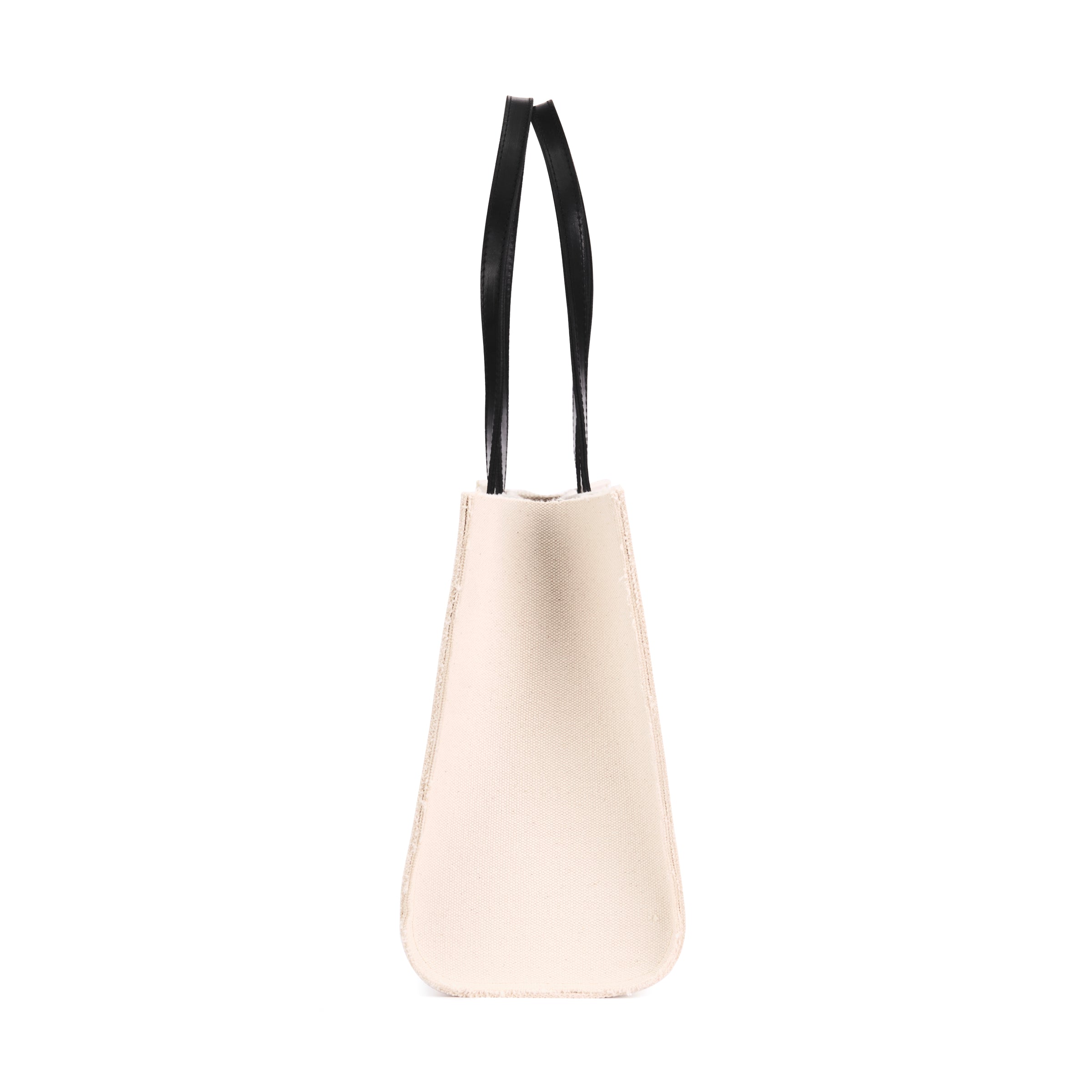 A side view of the Ava Canvas Tote in Black by Ezra Arthur