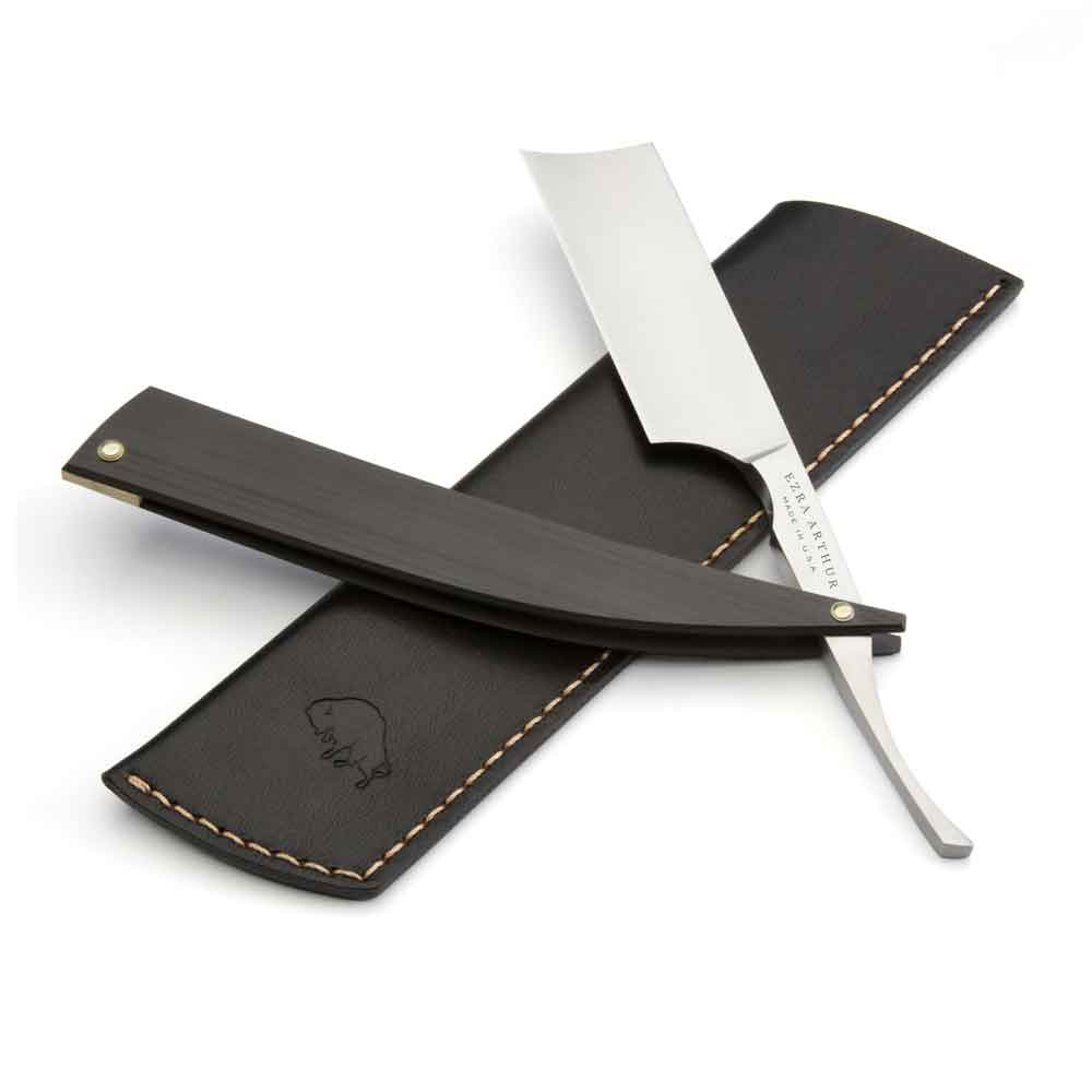 A top view of the Ezra Arthur x Max Sprecher Signature Straight Razor with a black leather sleeve