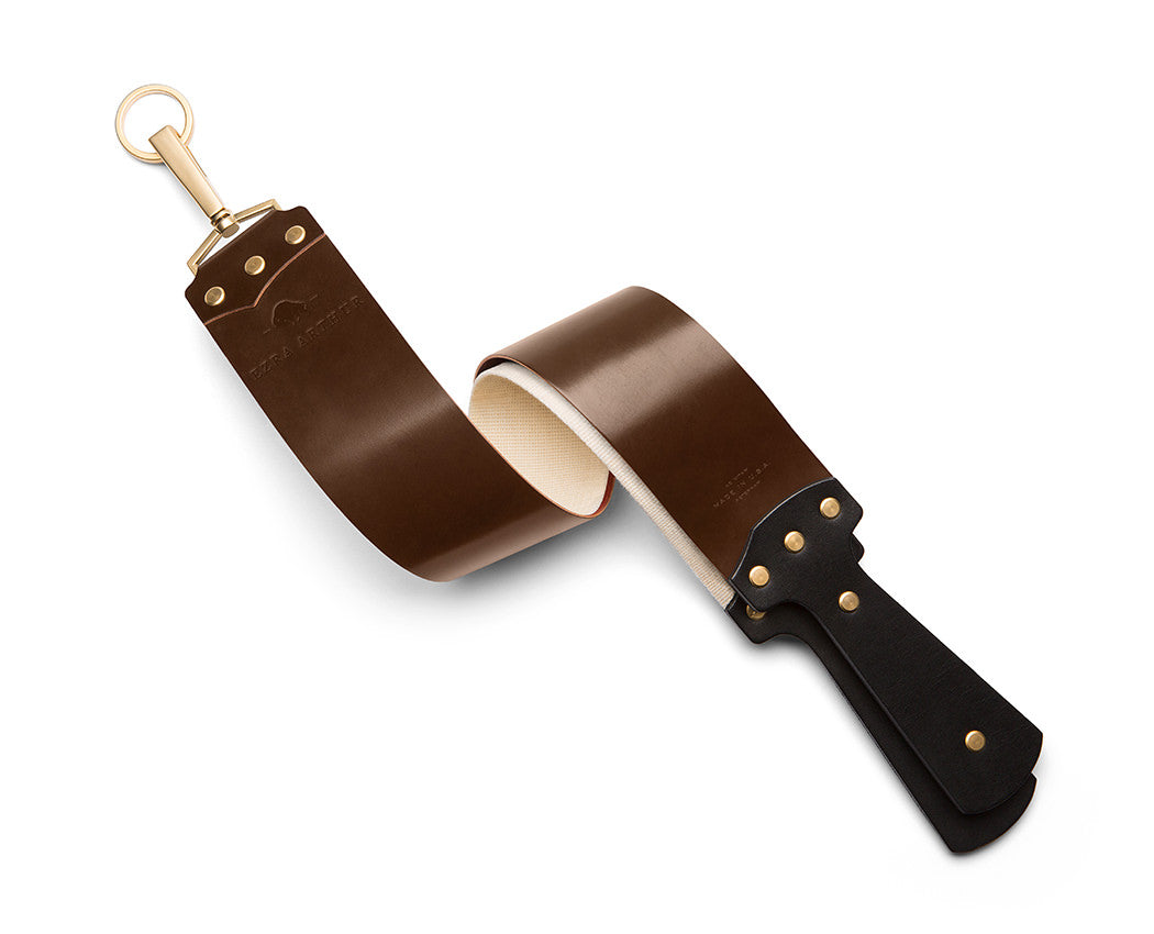brown leather shaving strop with gold hardware