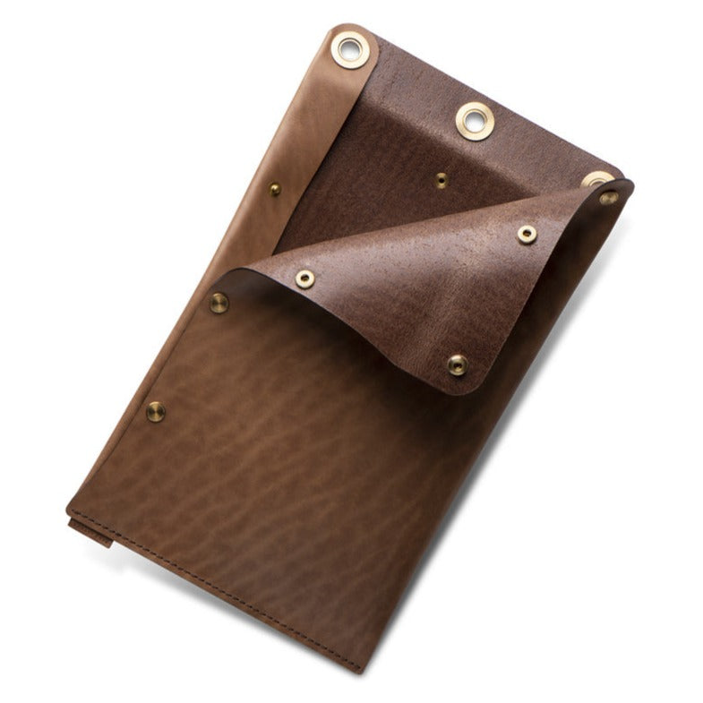 brown leather flat lay dopp kit