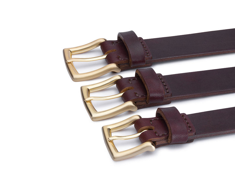 trio of rich red brown leather belts