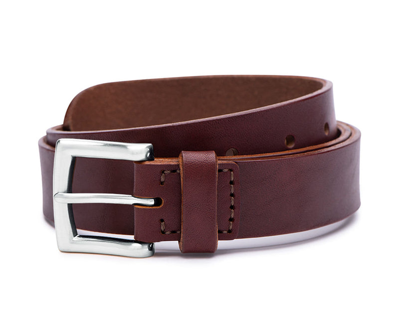 silver buckle detail on brown leather belt