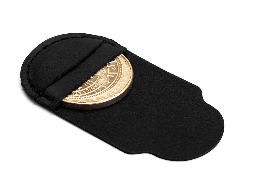 coin in all-black leather pouch