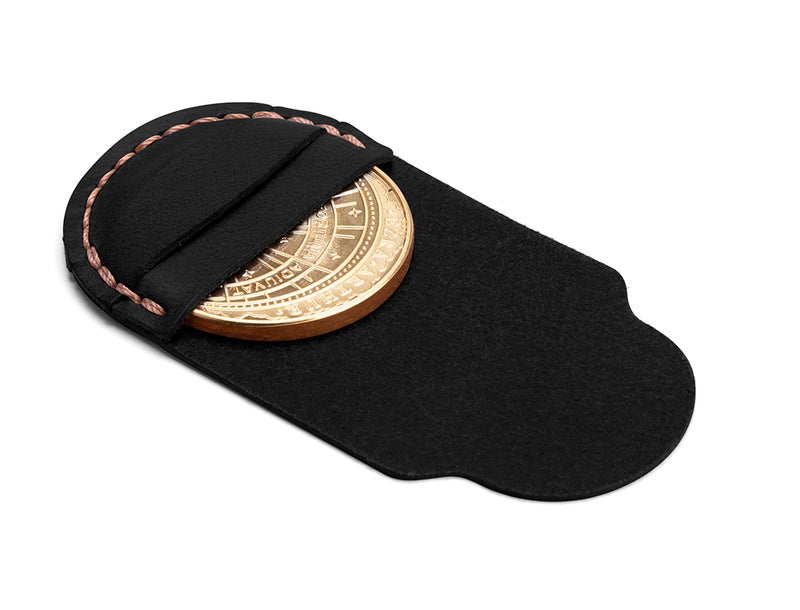 decision coin in black leather holding pouch