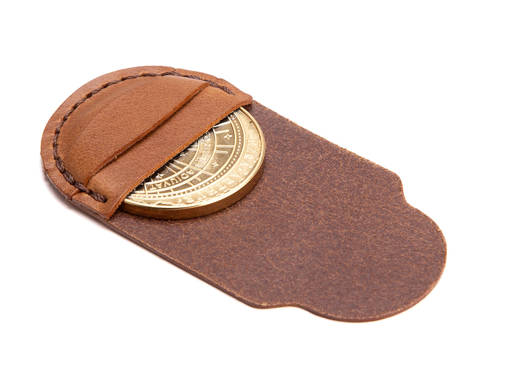 decision coin in leather pouch