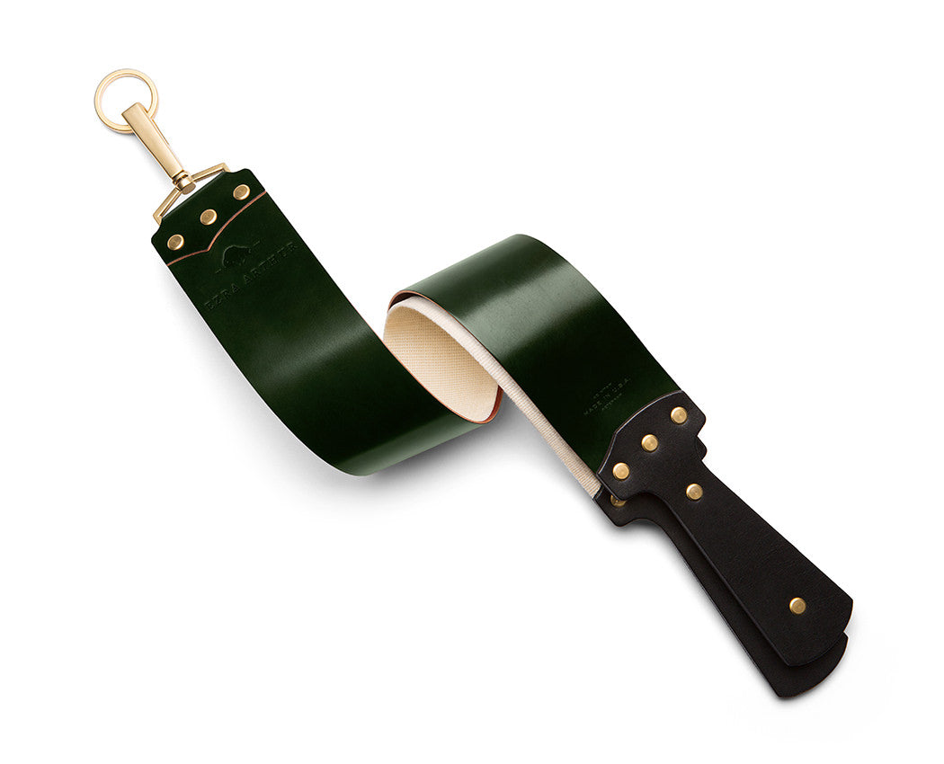 green leather shaving strop with gold hardware