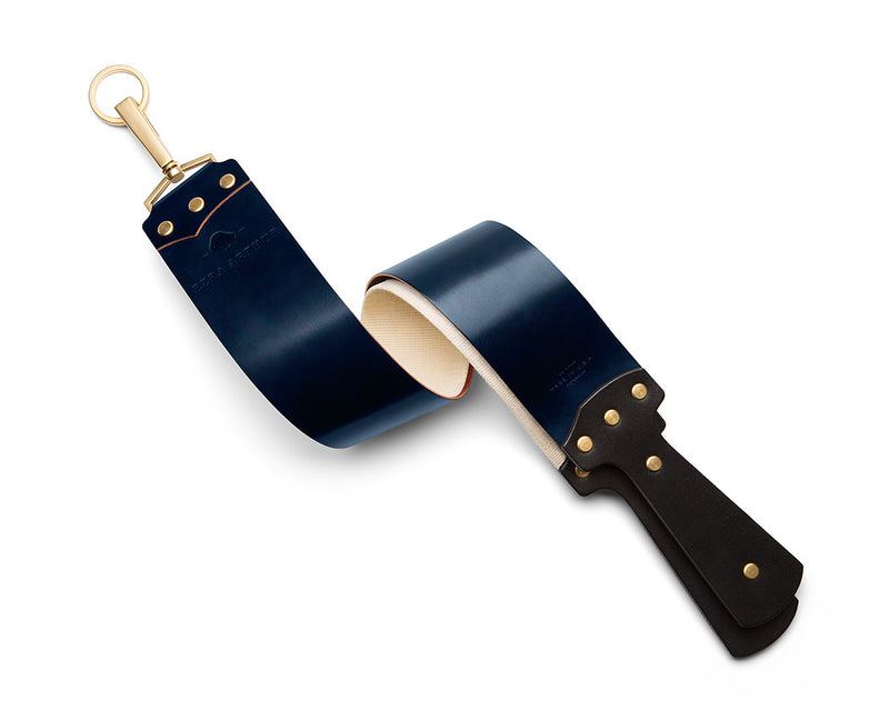 navy leather strop with gold hardware