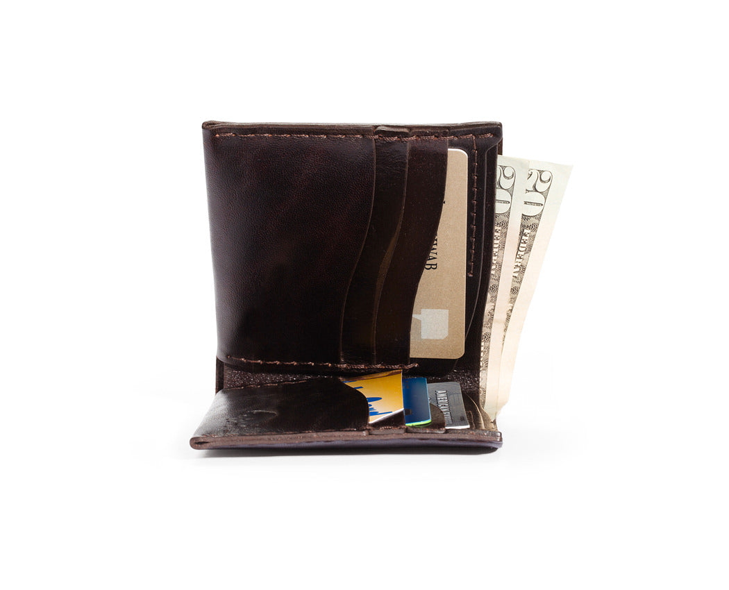 brown leather wallet with credit cards and cash